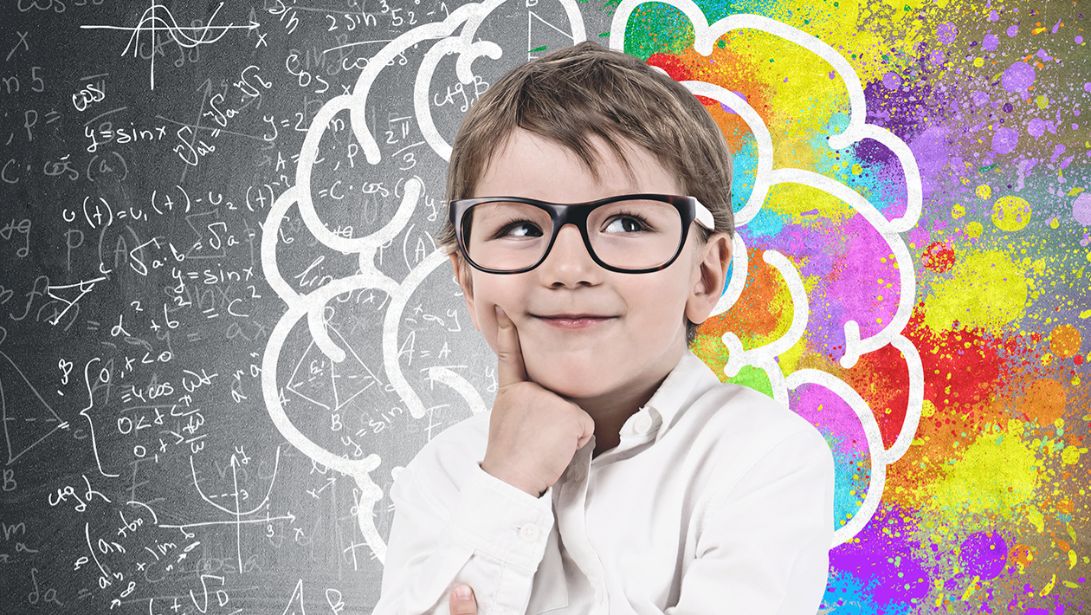 Little boy in glasses deep in thought, brain sketch, formulas and colorful patches in the background